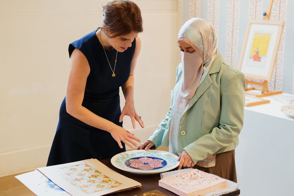 Princess Eugenie speaks with woman