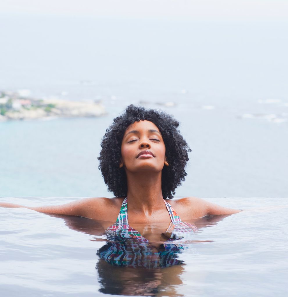 Young woman relaxing in swimming pool