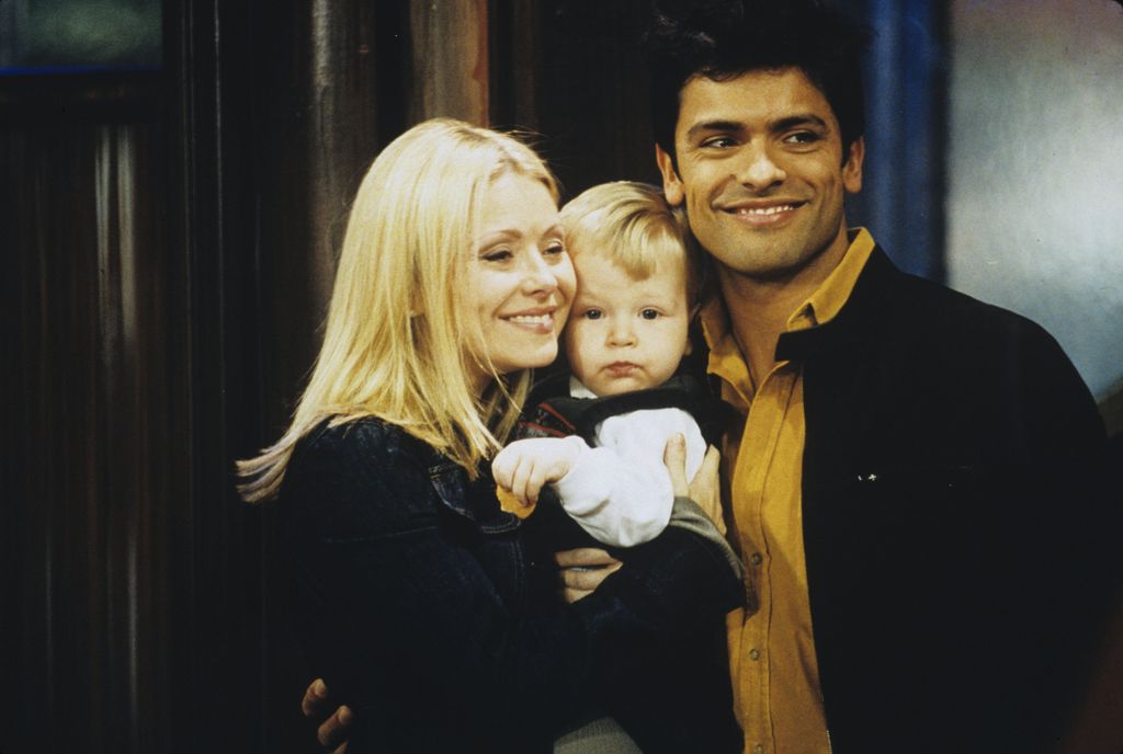 Kelly Ripa as Hayley Vaughn and Mark Consuelos as Mateo Santos on All My Children with their baby boy Enzo, December 18, 2002