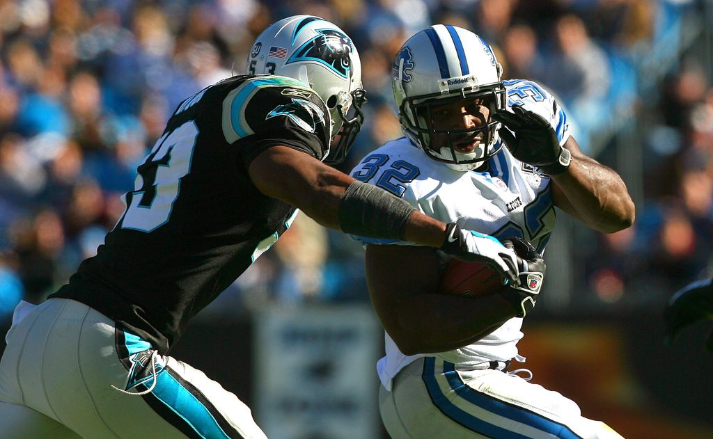 Rudi Johnson #32 of the Detroit Lions is tackled by Na'il Diggs #53 of the Carolina Panthers at Bank of America Stadium on November 16, 2008 in Charlotte, North Carolina