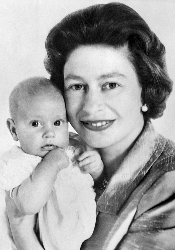 Close-up black and white photo of Queen Elizabeth II with Prince Edward in June 1964