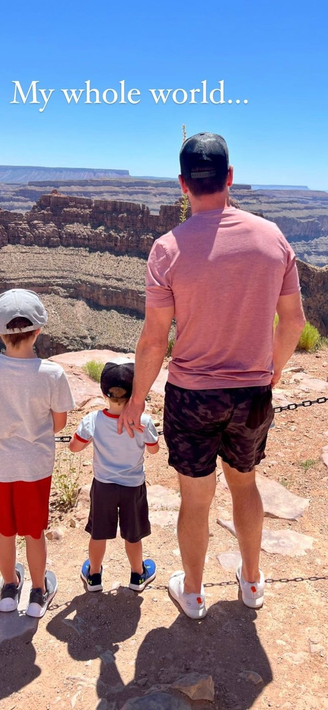 Carrie Underwood's husband and sons outside taken from behind