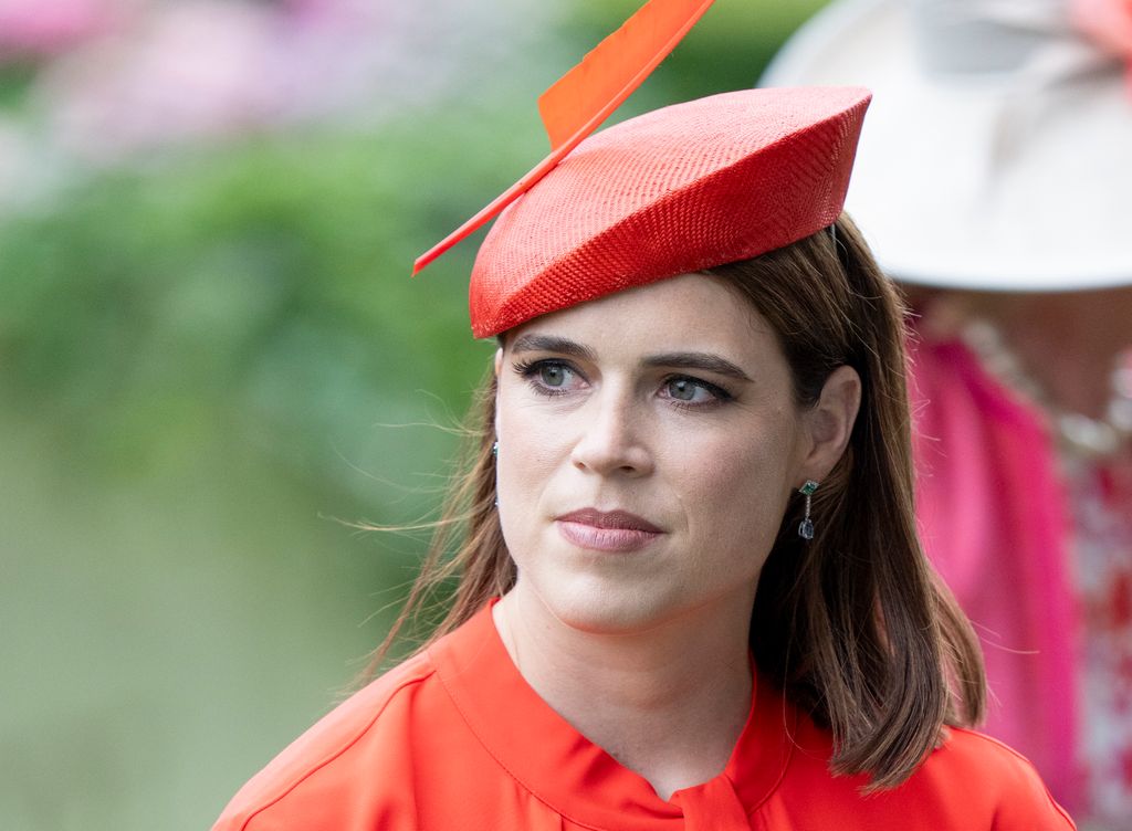 Princess Eugenie wearing red hat and dress at Royal Ascot