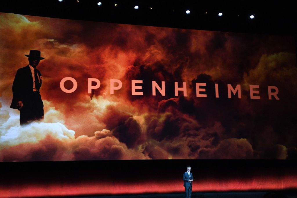 British director Christopher Nolan speaks on stage about his movie "Oppenheimer" during Universal Pictures and Focus Features presentation at CinemaCon 2023, the official convention of the National Association of Theatre Owners (NATO), at The Colosseum at