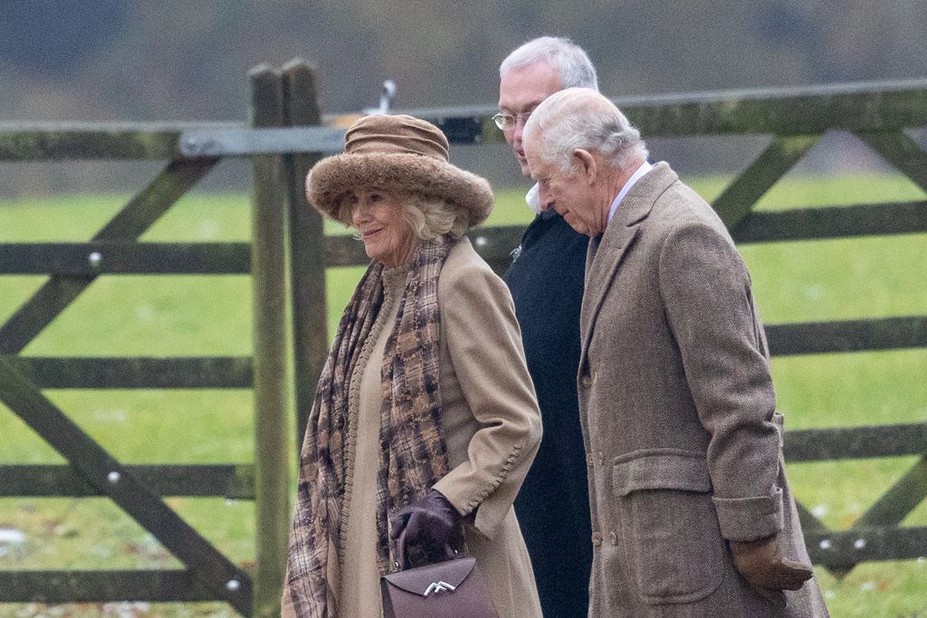King Charles and Queen Camilla with the Reverend Canon Paul Williams.