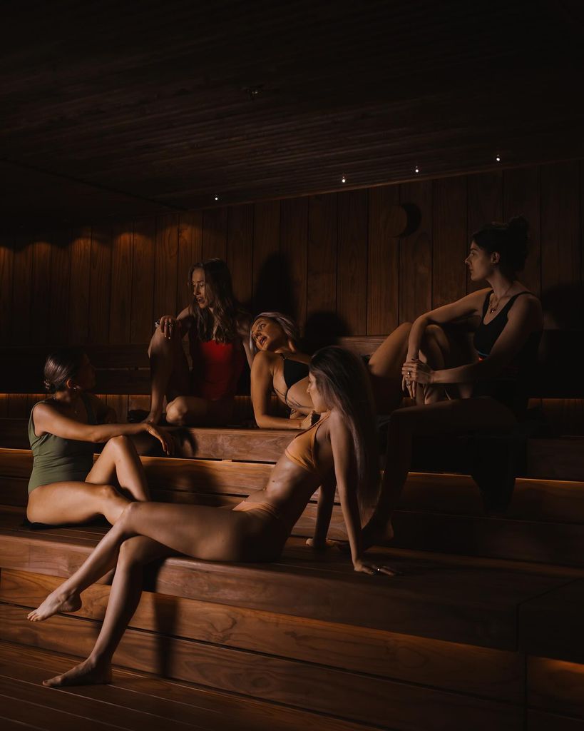 Group of people relaxing in a sauna