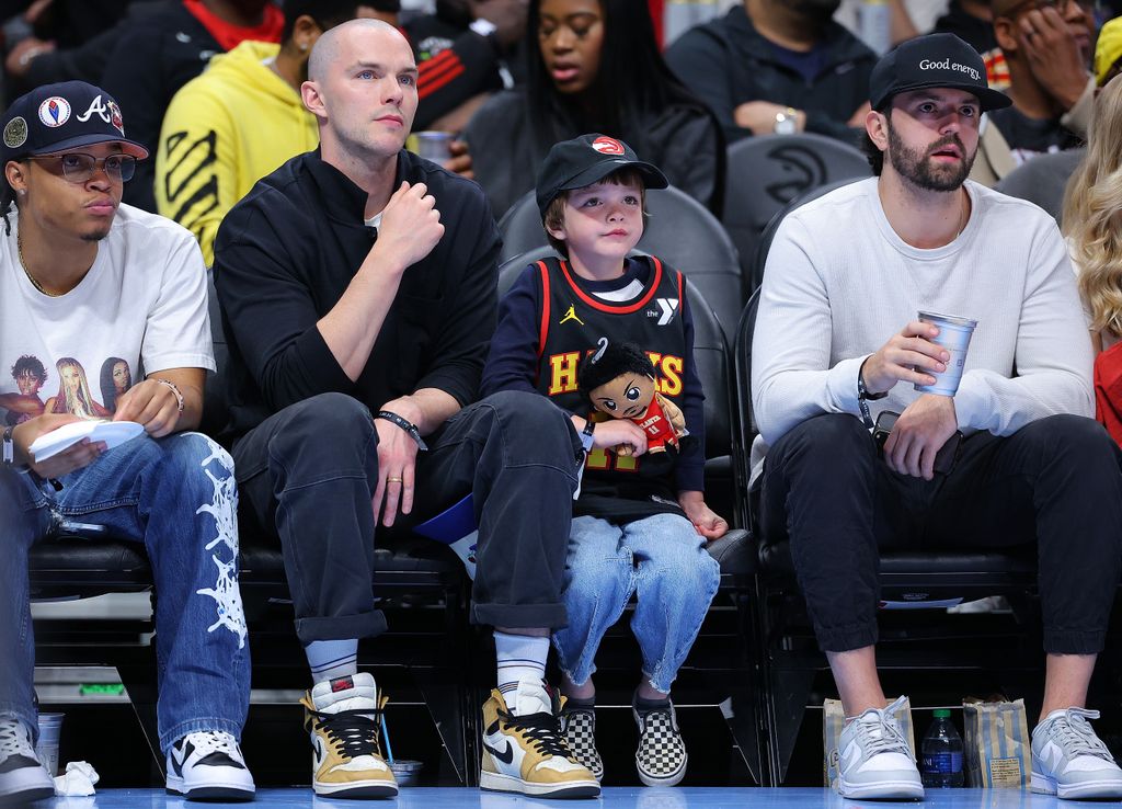 X-Men star Nicholas Hoult and his son at an NBA game in Atlanta