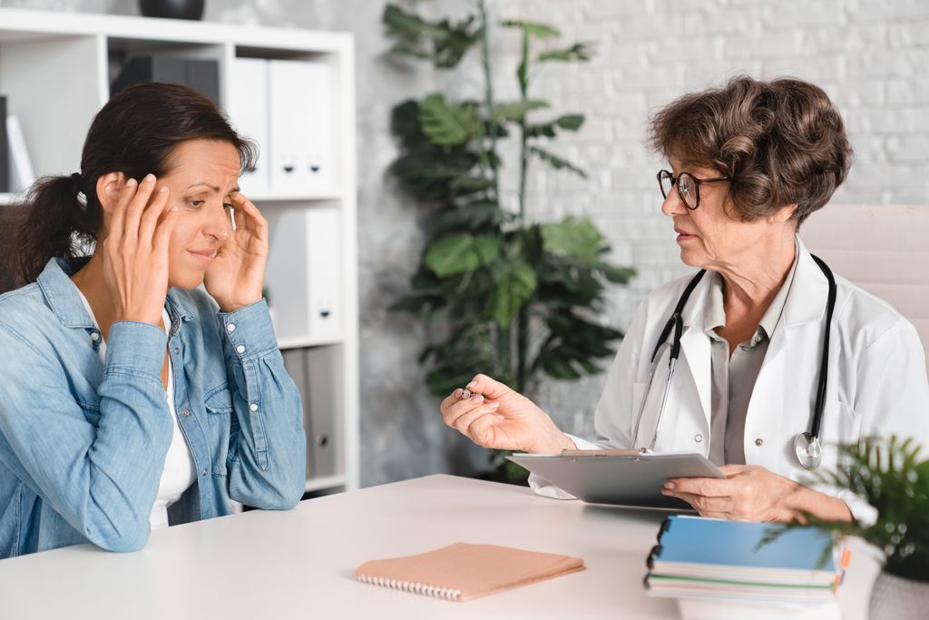 woman speaking to doctor