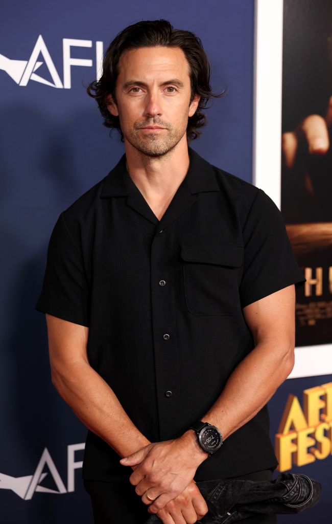 milo ventimiglia wearing black shirt with long hair