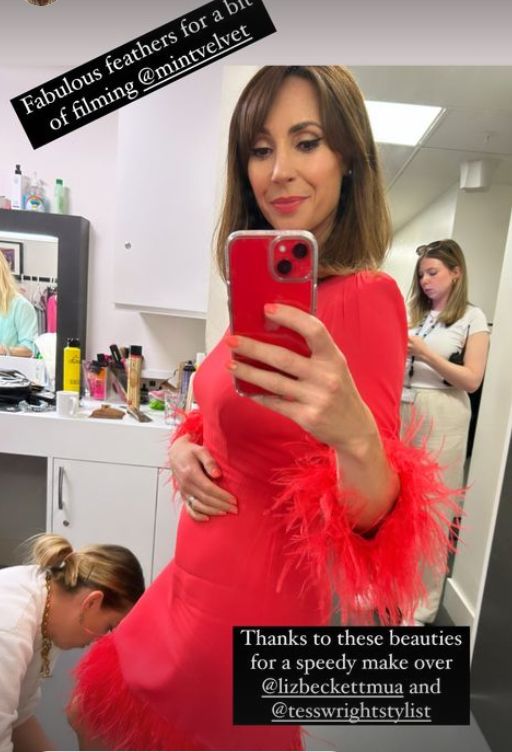 Alex Jones in red feathered dress