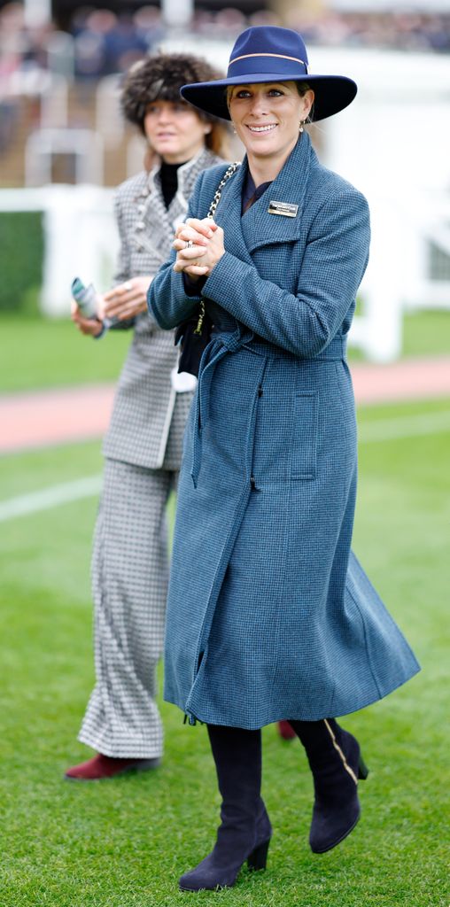 Zara Tindall at races in blue coat and hat