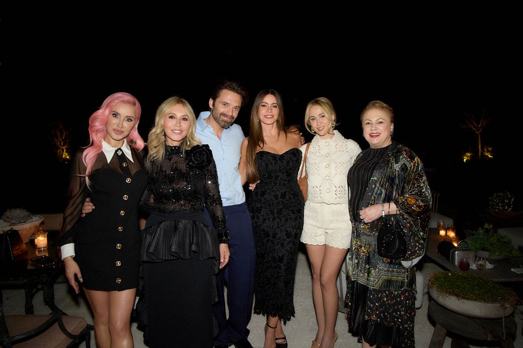 Anastasia Soare (2L) poses with Sebastian Stan (3L) and Sofa Vergara (3R) and guests at a party