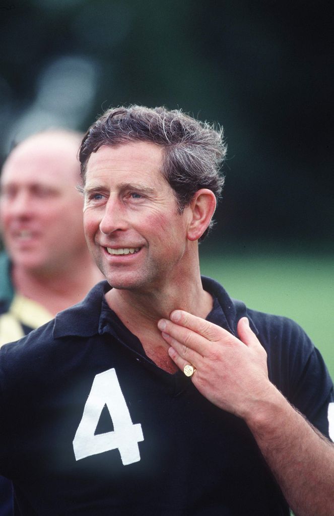 The then Prince of Wales wearing his signet ring and wedding ring to Princess Diana in 1993
