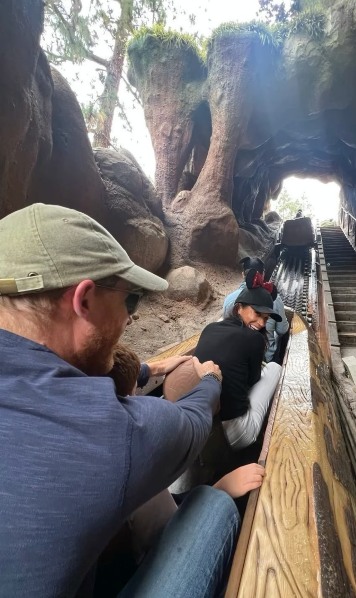rollercoaster ride with people wearing caps