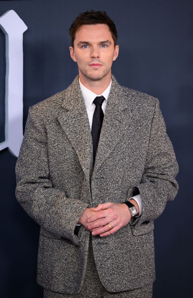 Nicholas Hoult wears gold band 