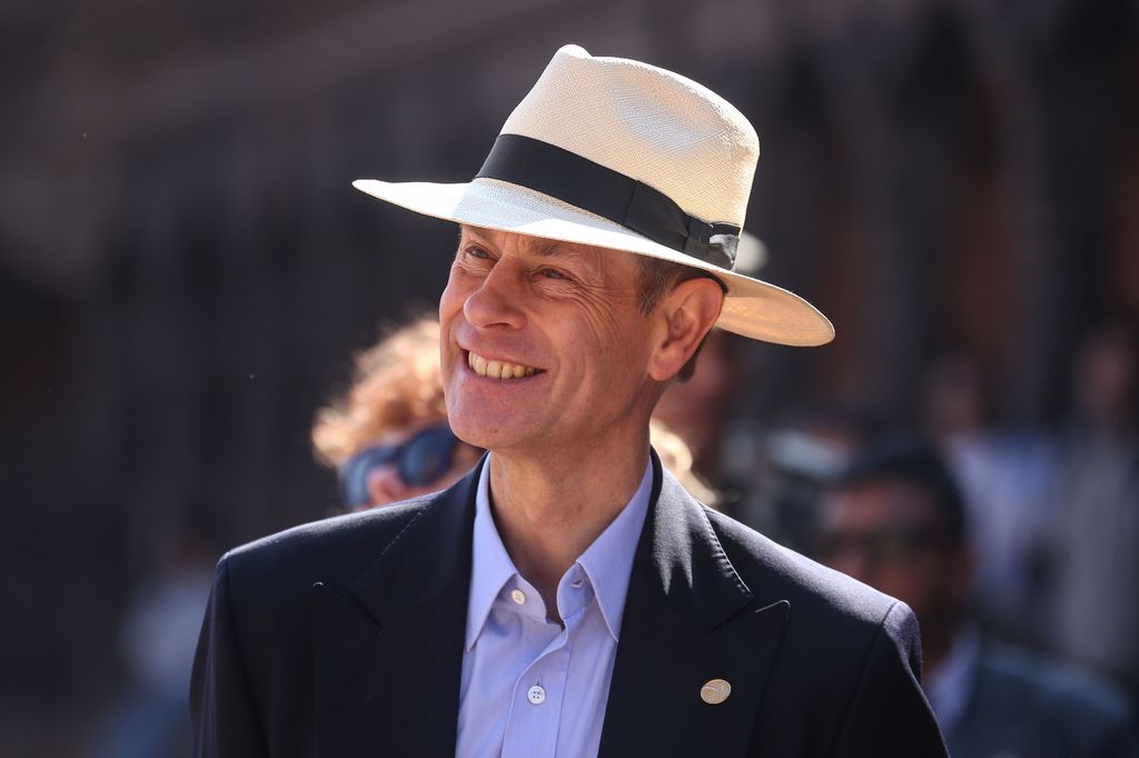 Prince Edward smiling and wearing a hat