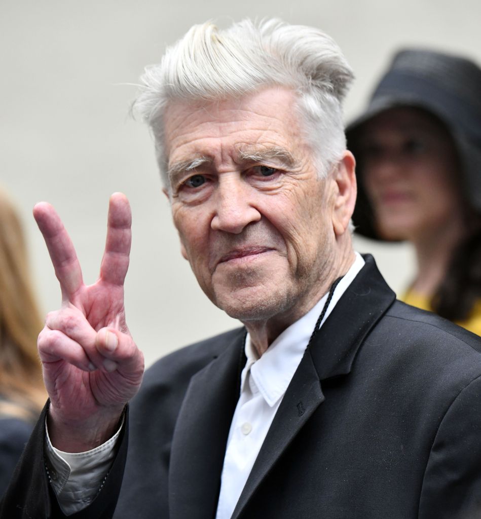 David Lynch giving a peace sign