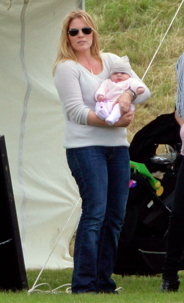 Aw just look how cute Isla was as a baby! Mum Autumn carries her little girl at the Golden Metropolitan Polo Club Charity Cup polo match back in June 2012.