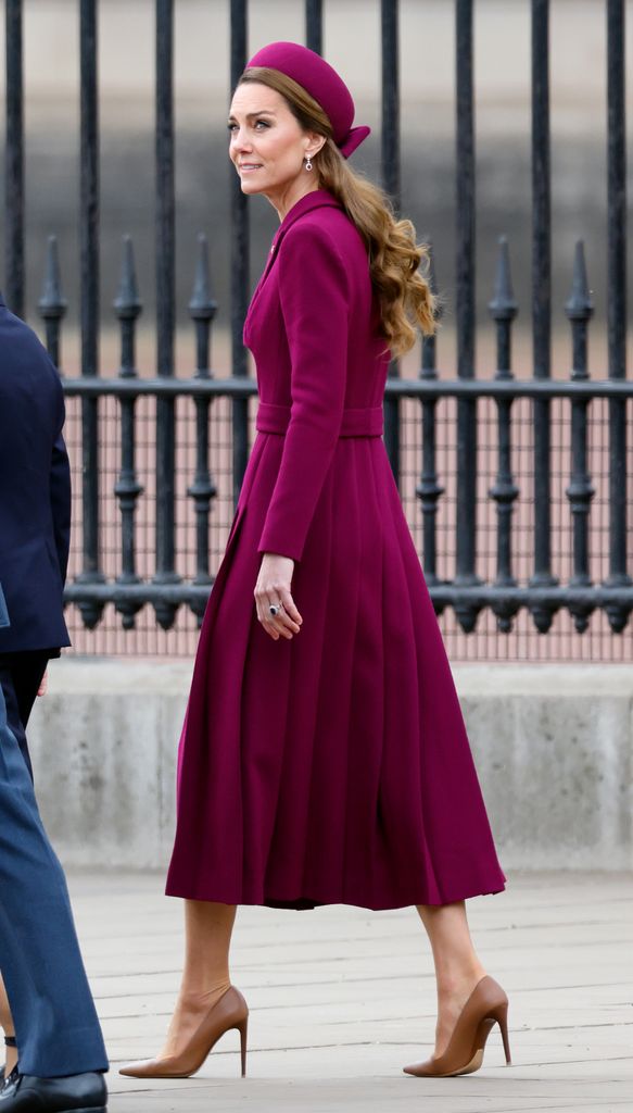 The Princess of Wales walking in purple coat dress and hat