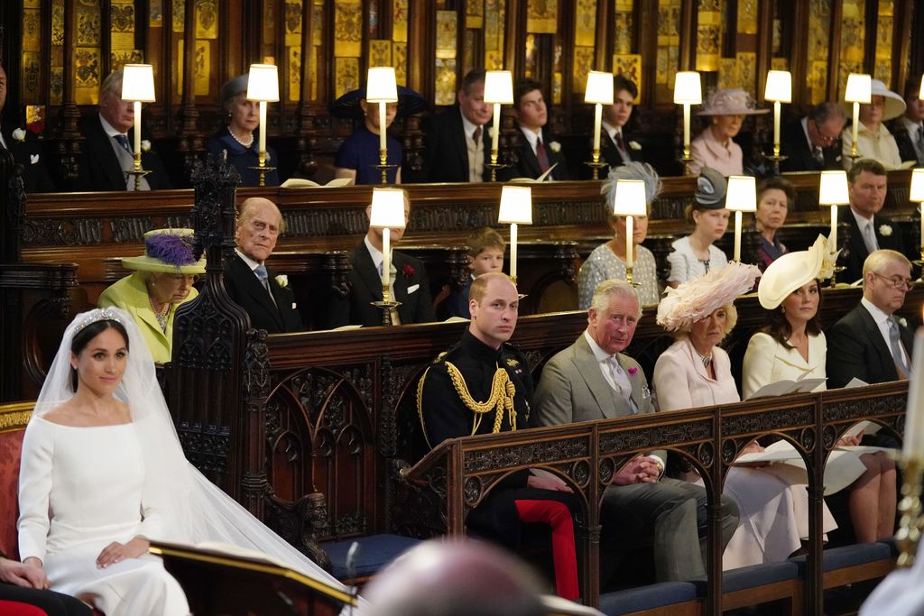 Meghan Markle in St George's Chapel watched by royals including Queen Elizabeth II, the Princess Royal, and the Prince of Wales