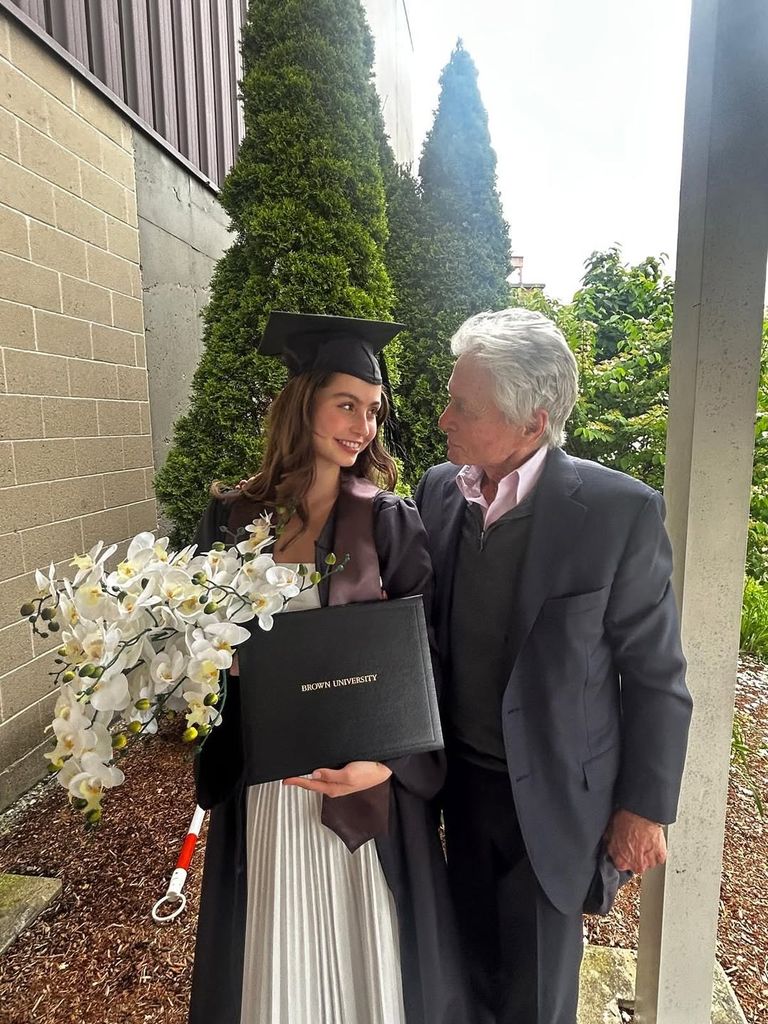 Michael Douglas and Carys Douglas pose for a photo during Carys' graduation from Brown University, shared on Instagram