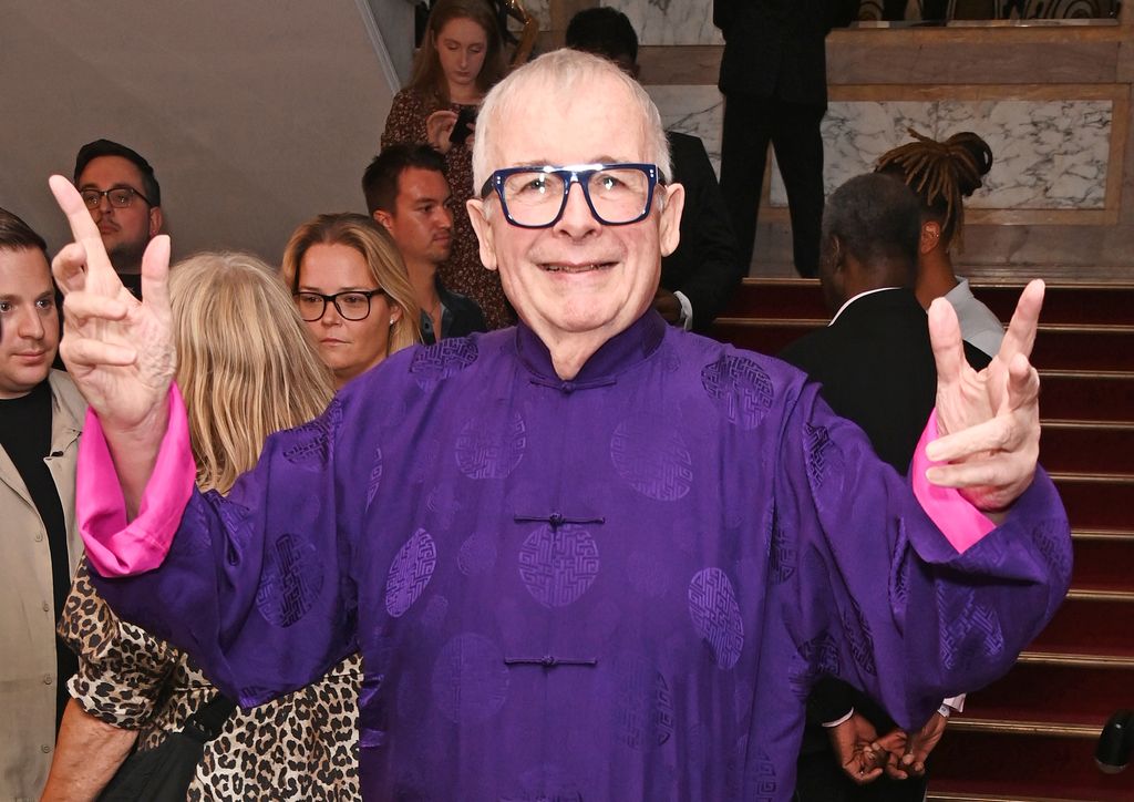Christopher Biggins in a purple and pink robe