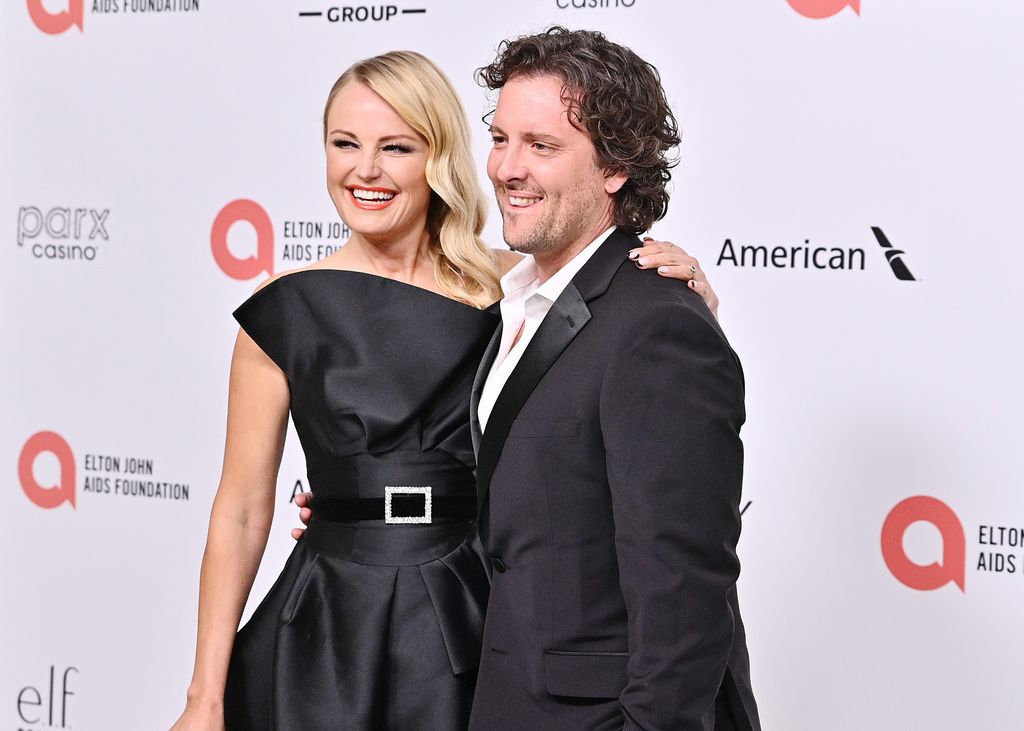 Malin and Jack smiling for the cameras