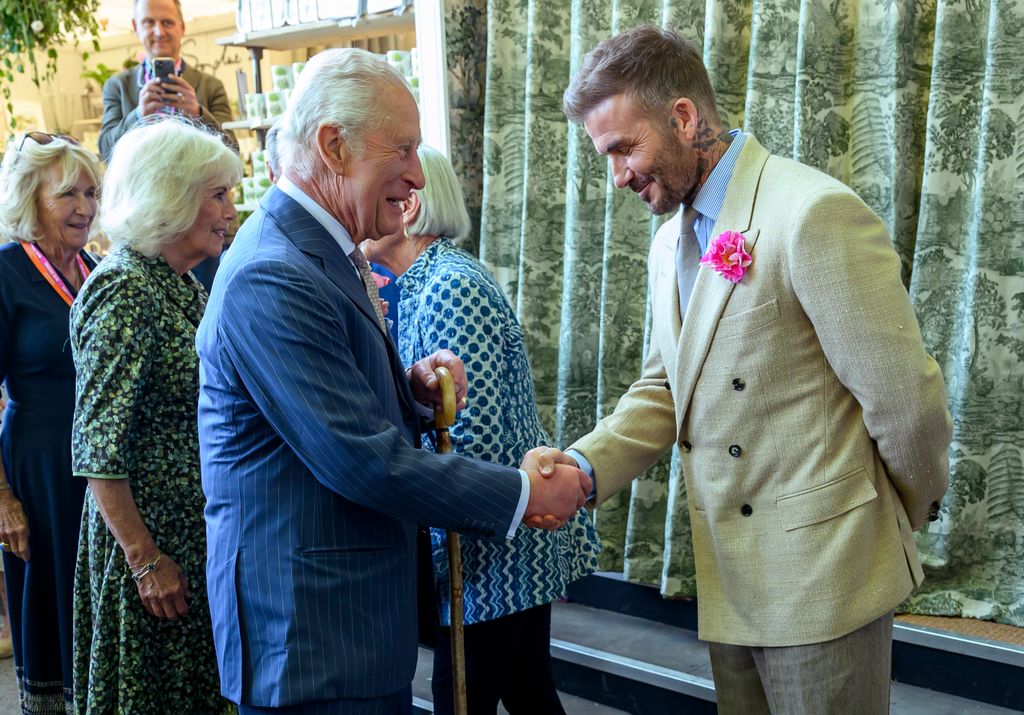 charles chatting to David Beckham at flower show 