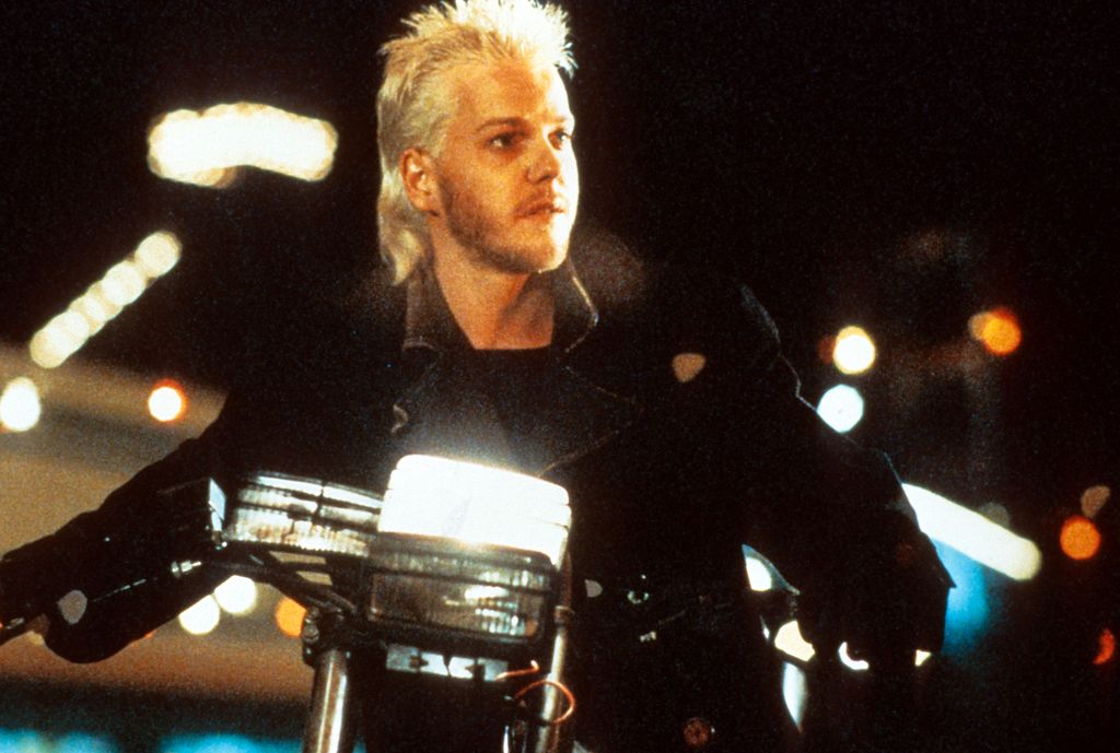 Kiefer Sutherland riding a motorcycle in a scene from the film 'The Lost Boys', 1987