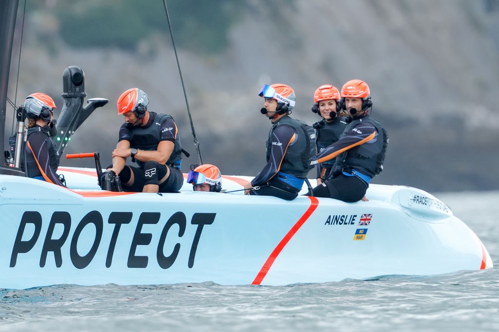 Catherine, Duchess of Cambridge (second right) onboard Sir Ben Ainslie's Great Britain SailGP F50 foiling catamaran 