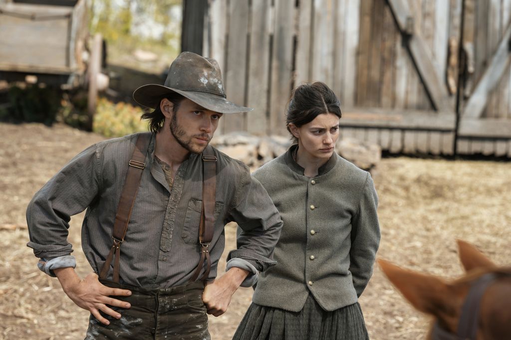 man and woman standing outdoors