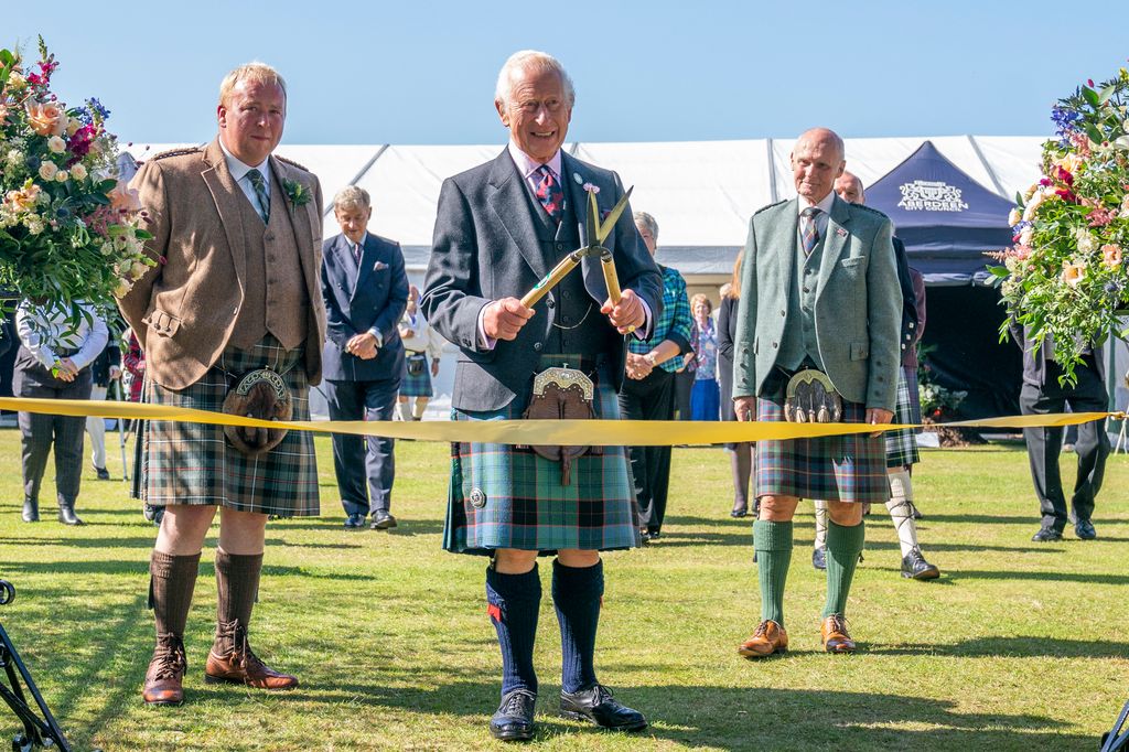 King Charles cutting ribbon