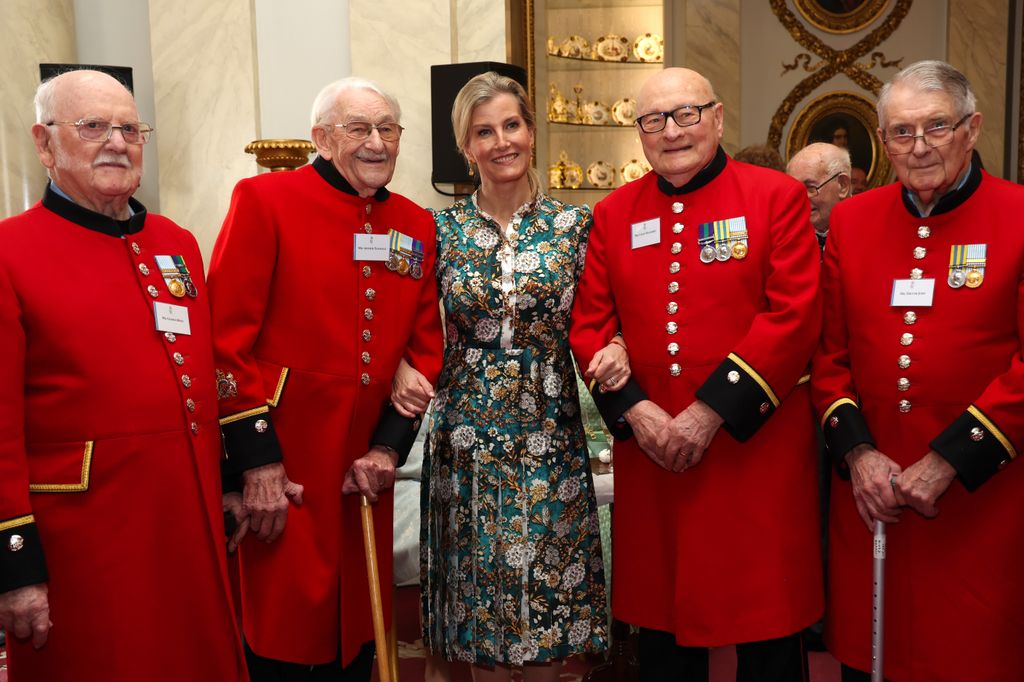 Duchess Sophie poses for a picture with war veterans during a reception for Korean war veterans