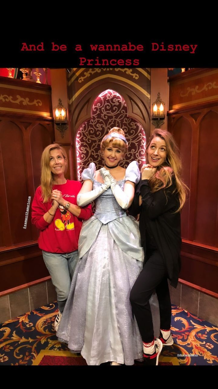 Blake Lively posing with Disney princess Cinderella