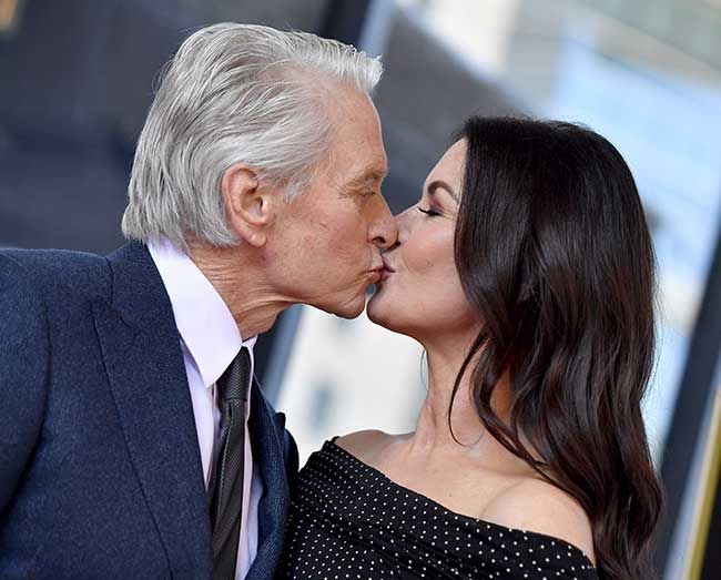 Catherine Zeta Jones and Michael Douglas kiss