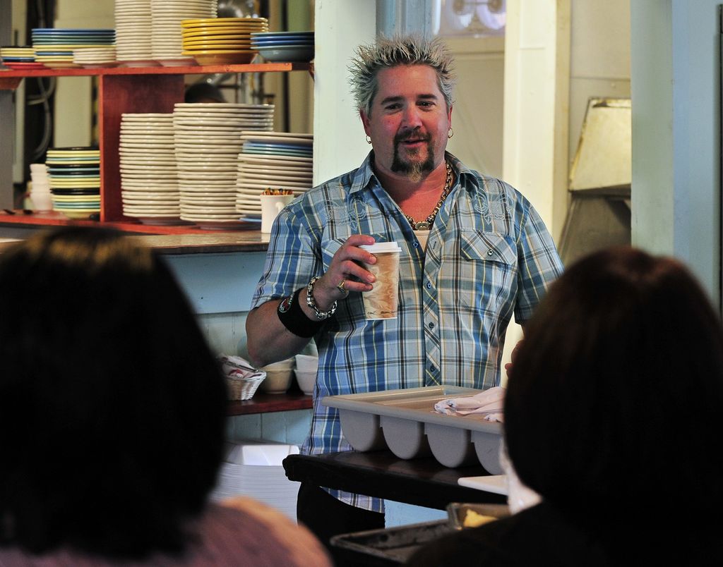 Tuesday, June 1, 2010, The Food Network's show, "Diners, Drive-ins and Dives" films at the Port Hole Restaurant on the Waterfront. Star of the show, Guy Fieri, chats with customers between takes