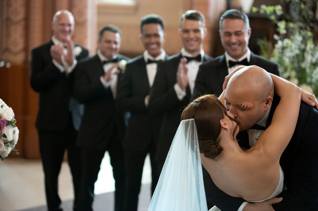 Joe Minoso kissing actress Kristen Gutoskie on-screen wedding in Chicago Fire