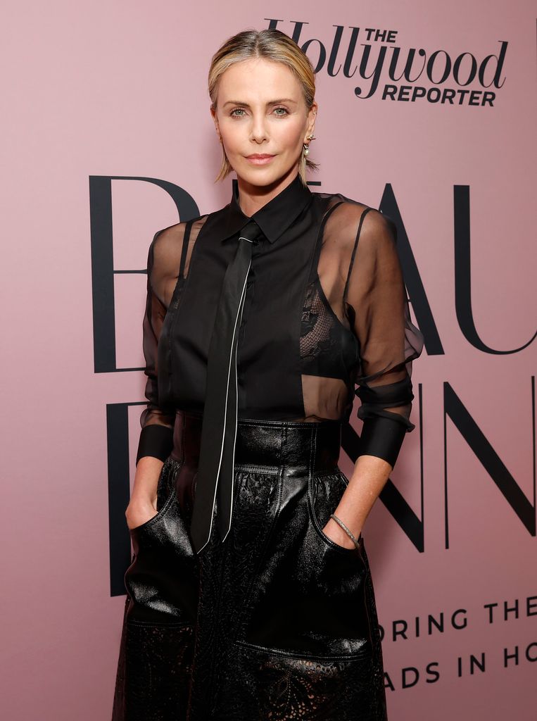 Charlize Theron in all black sheer leather look