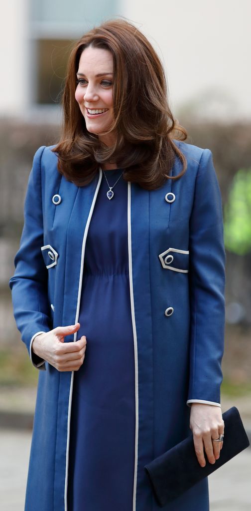 A photo of Princess Kate wearing a royal blue coat and dress