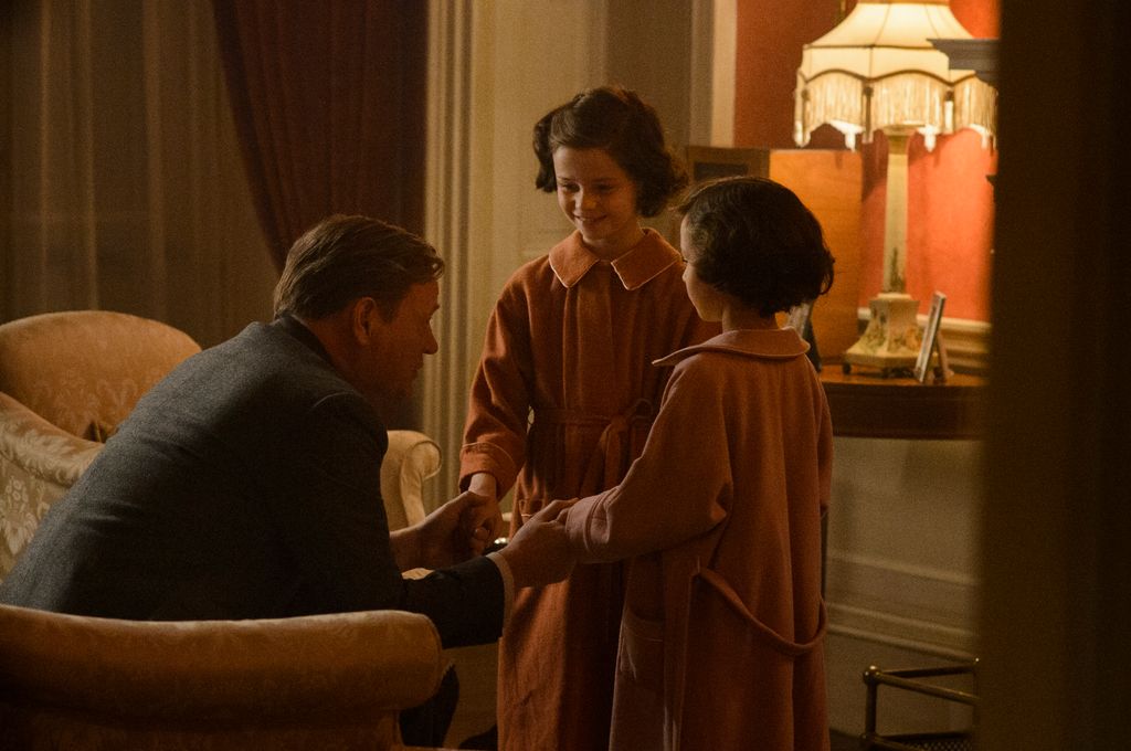 The Crown season one, Jared Harris as King George with young Princesses Elizabeth and Margaret