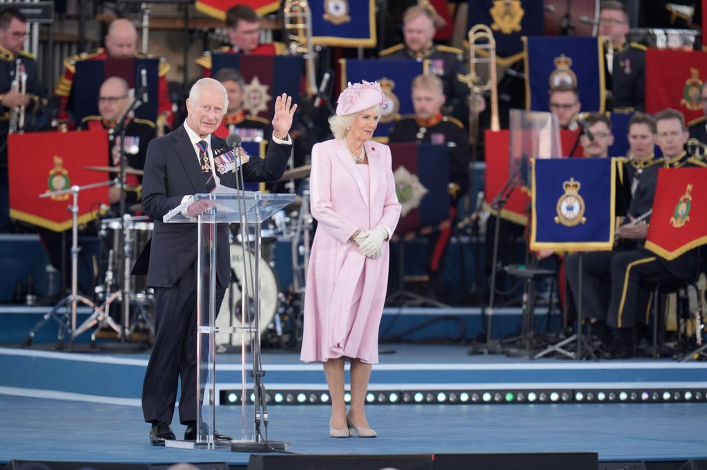 king charles and queen camilla on stage 