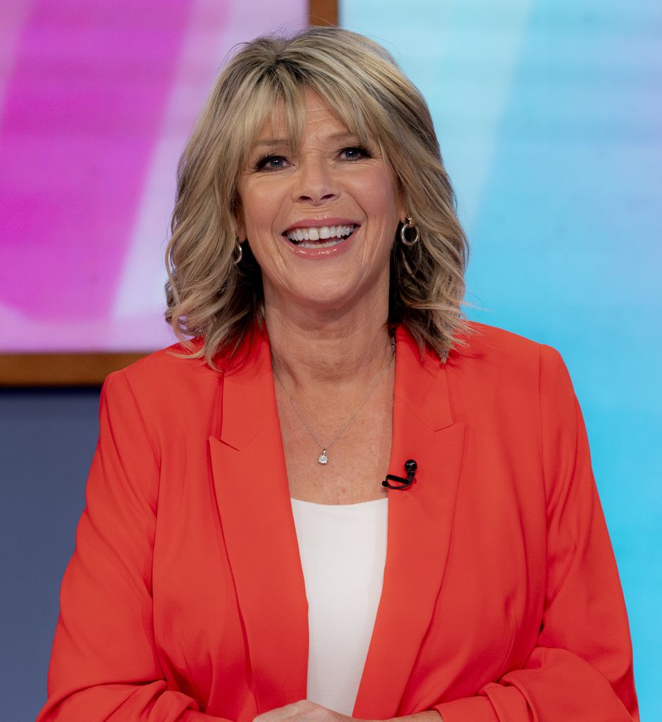 Ruth Langsford smiling in orange blazer