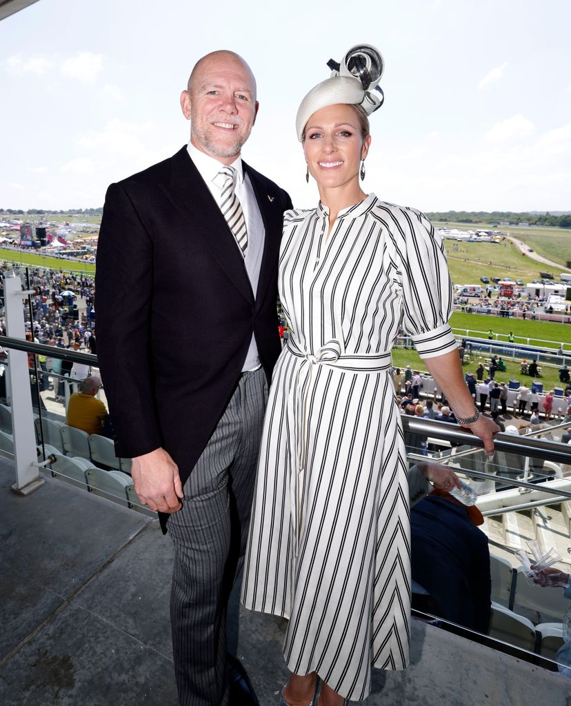 zara tindall in a striped dress with a bleted waistline