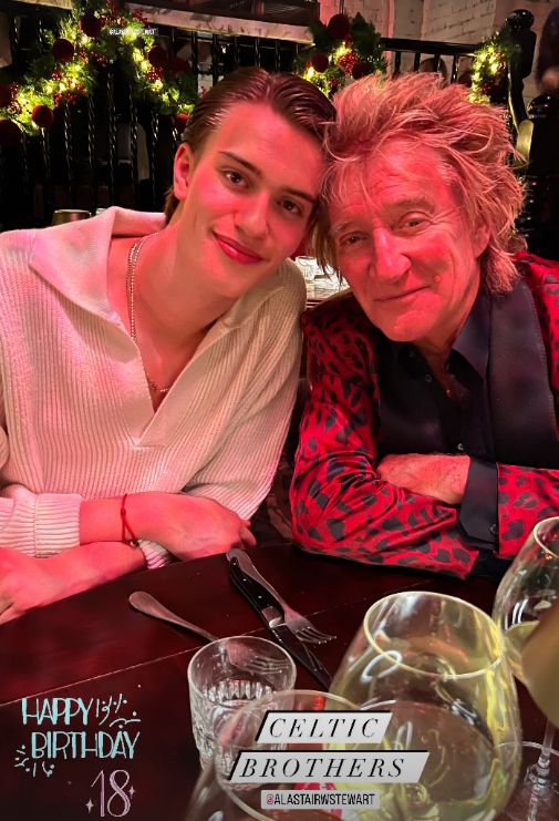 Alastair and Rod Stewart sat at a restaurant