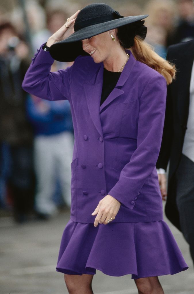 The Duchess of York wearing a purple suit at the wedding of the Marquis of Marlborough and Rebecca Few Brown