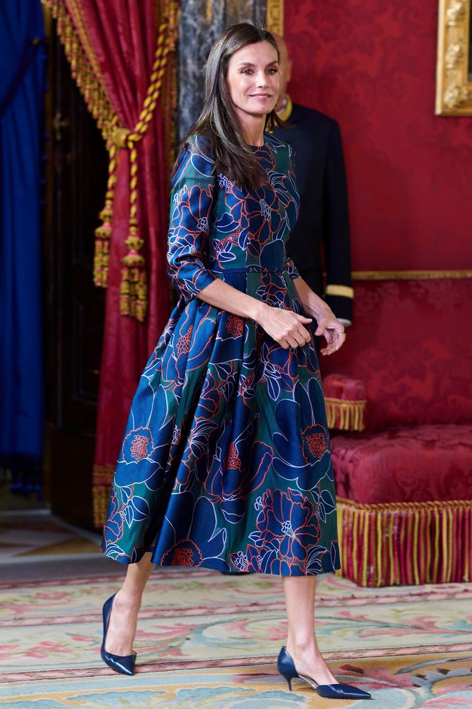 Letizia walking in palace in blue floral dress and heels 