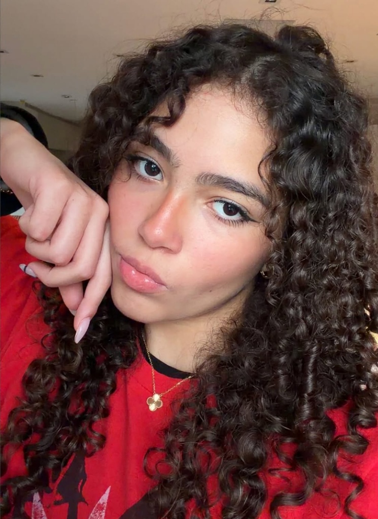 Selfie shared by Mariah Carey's daughter Monroe Cannon in a red t-shirt