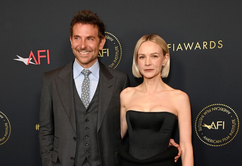 LOS ANGELES, CALIFORNIA - JANUARY 12: (L-R) Bradley Cooper and Carey Mulligan attend the AFI Awards Luncheon at Four Seasons Hotel Los Angeles at Beverly Hills on January 12, 2024 in Los Angeles, California. (Photo by Jon Kopaloff/WireImage)