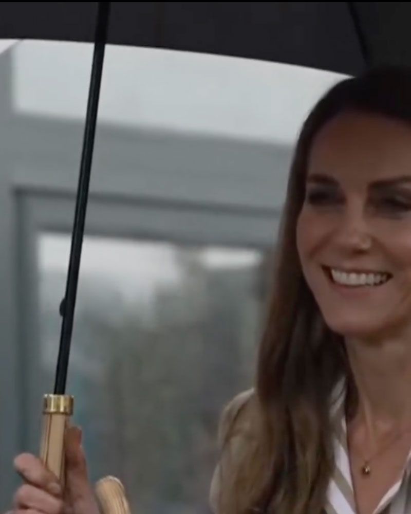 Princess Kate was smiling despite the poor British weather