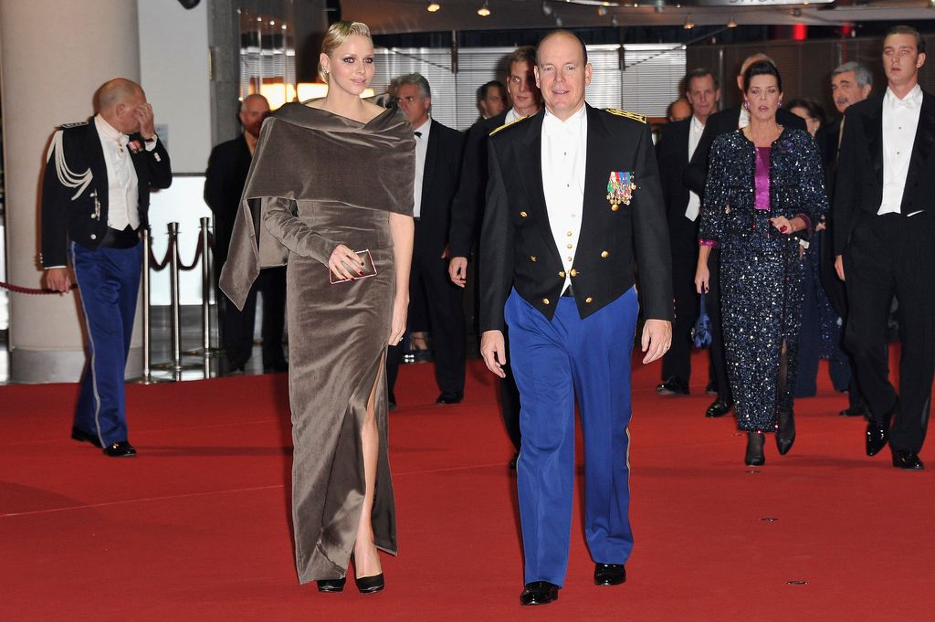Princess in asymmetrical dress with albert on red carpet